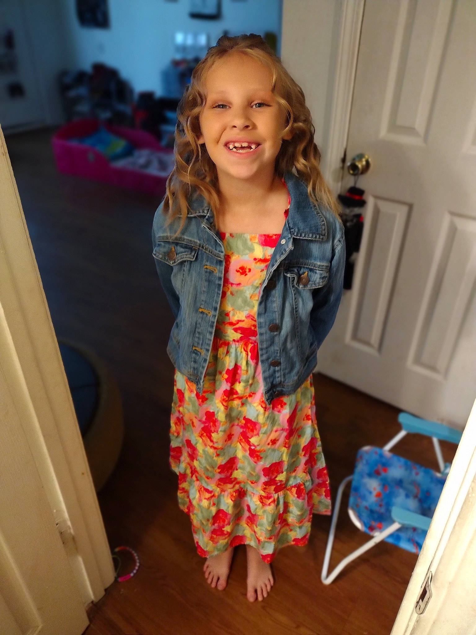 Adelynn is registered to the contest to win money with this photo: baby_toddler_clothing, blue, chair, child, door, electric_blue, event, fashion_design, flooring, fun, happy, hardwood, joy, pattern, person, room, sleeve, smile, standing, toddler