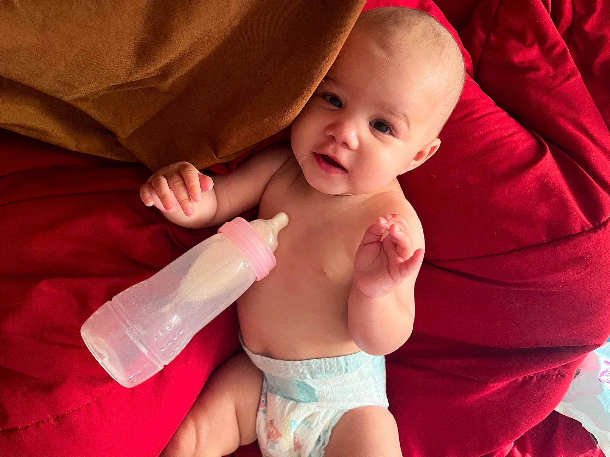 Elliana joined the competition — help win amazing prizes! arm, baby, comfort, facial_expression, finger, gesture, hand, happy, lip, mouth, muscle, neck, nose, organ, person, pink, skin, smile, stomach, textile