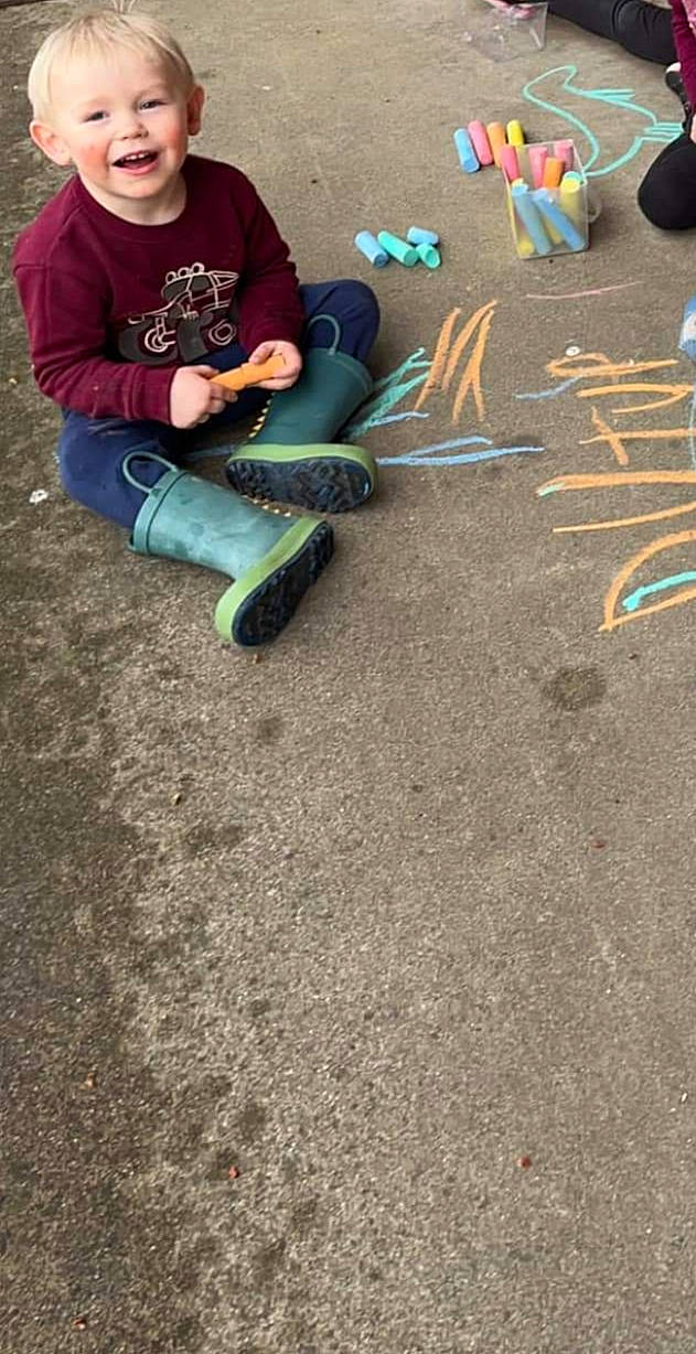 Nash joined the competition — help win amazing prizes! asphalt, chalk, concrete, flooring, fun, grass, joy, leisure, person, play, recreation, road, road_surface, sand, shadow, sidewalk, sitting, soil, t_shirt, tar