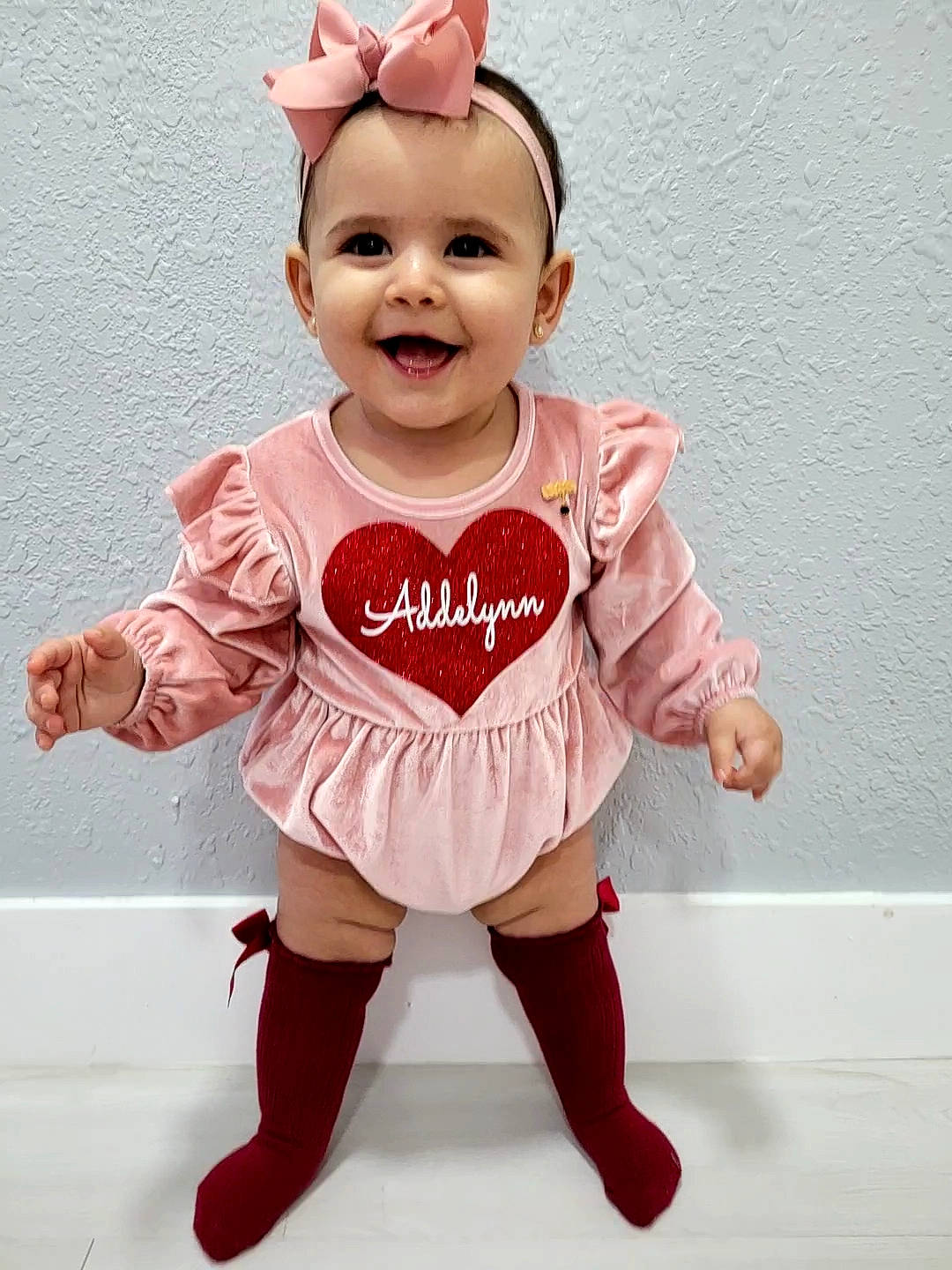 Addelynn joined the competition — help win amazing prizes! arm, baby, baby_toddler_clothing, cheek, eye, finger, gesture, hair, hand, happy, head, human_body, joy, outerwear, person, pink, skin, sleeve, smile, t_shirt