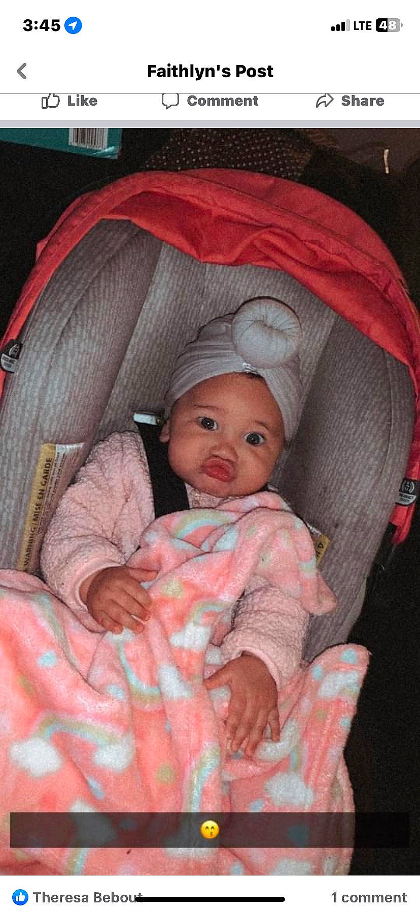 Raye is registered to the contest to win money with this photo: baby, baby_carriage, baby_products, baby_toddler_clothing, cheek, comfort, eye, head, headwear, human_body, iris, lap, linens, lip, mouth, person, pink, product, sitting, skin