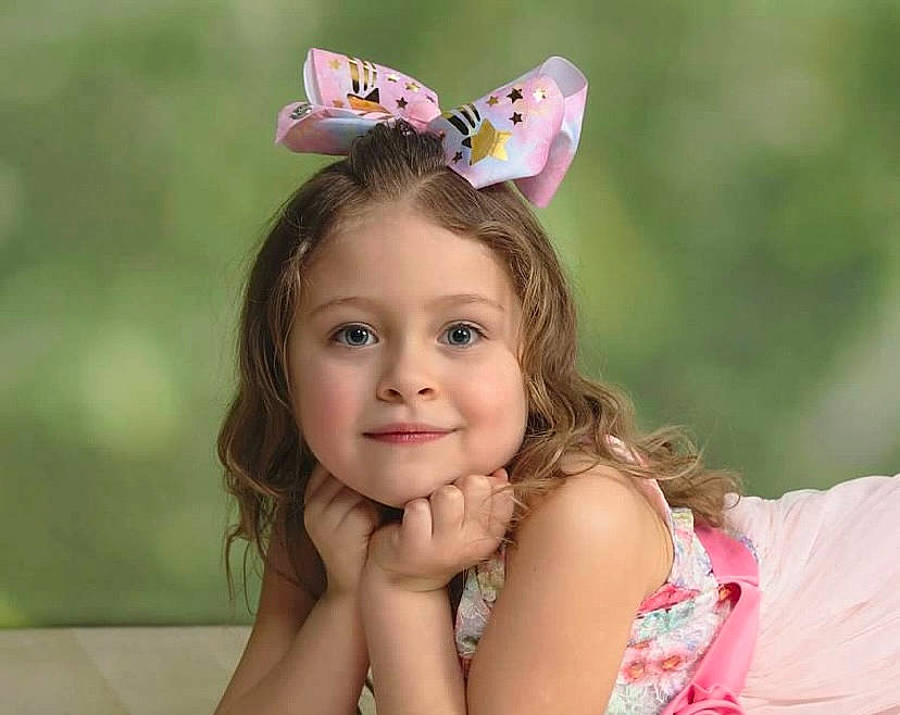 Yesenia joined the competition — help win amazing prizes! brown_hair, dress, face, finger, fun, grass, happy, insect, joy, leisure, moths_and_butterflies, people_in_nature, person, photograph, pink, plant, pollinator, recreation, smile, summer