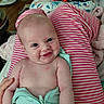 Willow joined the competition — help win amazing prizes! baby, infant, smile, happy, child, person, clothing, striped, legs, indoor, furniture, blanket, hand, cute, skin, portrait, cozy, home, expression, zipped_outfit