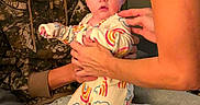 Willow joined the competition — help win amazing prizes! baby, child, person, man, indoor, pajamas, rainbow, clothing, holding, supporting, family, couch, sitting, hands, face, expression, young_adult, casual, home, comfort