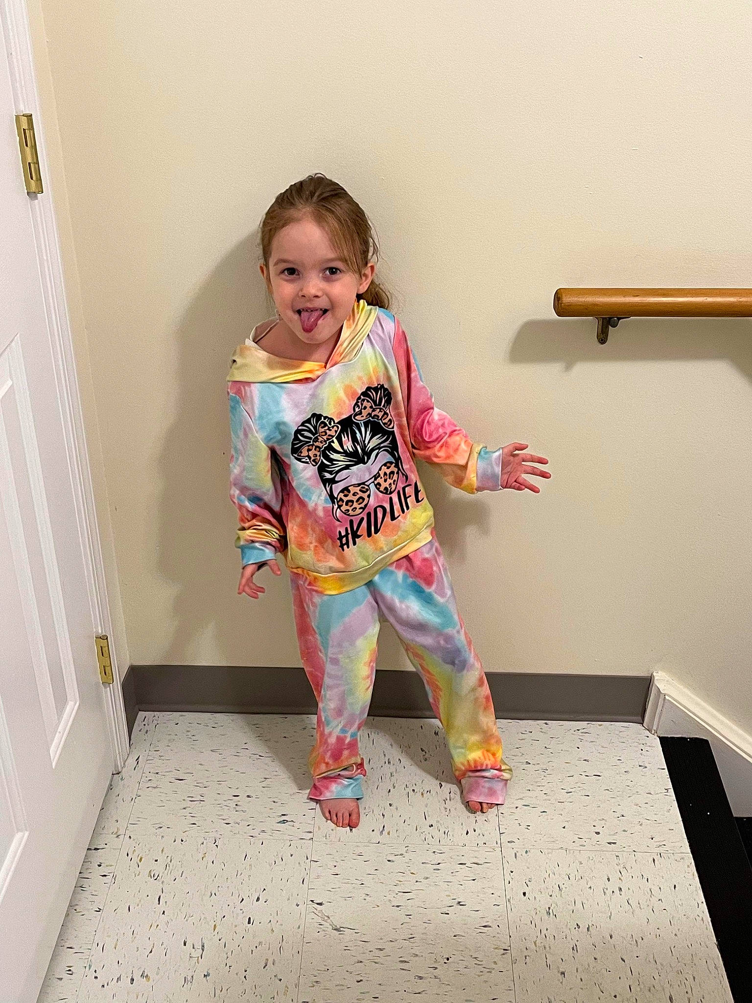 Lilliaunna is registered to the contest to win money with this photo: active_pants, baby_toddler_clothing, balance, child, clothing, door, fashion_design, flooring, hair, happy, human_body, human_leg, joy, knee, magenta, person, sleeve, smile, standing, t_shirt