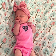 Fern joined the competition — help win amazing prizes! baby, newborn, infant, pink_onesie, headband, bow, blanket, owl_pattern, trees, sleeping, fingers_in_mouth, cute, child, resting, soft_texture, cozy, indoor, portrait, peaceful, small