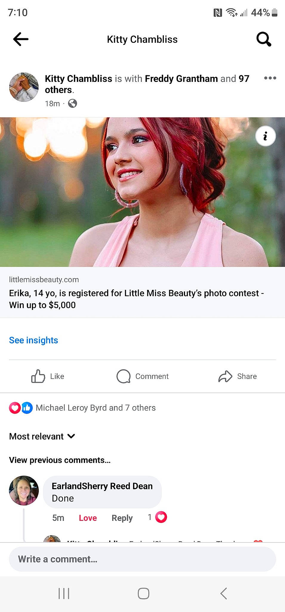 Erika is registered to the contest to win money with this photo: advertising, brand, eyelash, flash_photography, font, gesture, happy, joy, lipstick, logo, magenta, media, multimedia, online_advertising, person, red, red_hair, screenshot, smile, technology