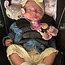 baby, car_seat, denim_jacket, pacifier, plush_toy, sleeping, child, infant, headband, socks, seatbelt, cute, adorable, clothing, baby_accessories, comfort, resting, safety, indoor, newborn