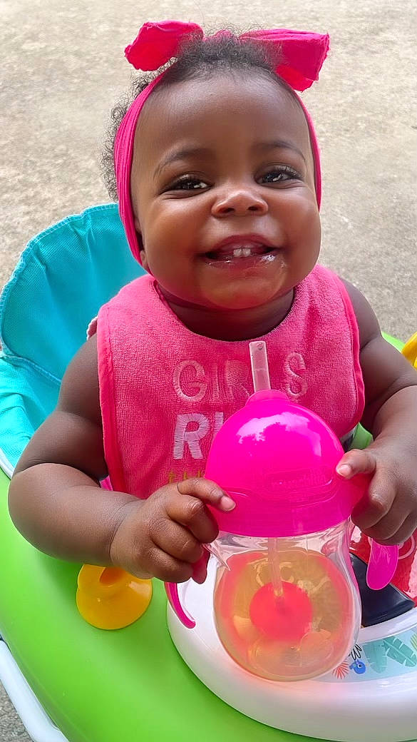 Iyonest is registered to the contest to win money with this photo: baby, baby_toddler_clothing, beauty, cheek, child, drinkware, event, fun, happy, leisure, magenta, party_supply, person, pink, product, skin, smile, sweetness, toddler, water