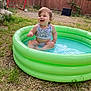 Ellanda is registered to the contest to win money with this photo: toddler, child, pool, inflatable_pool, water, grass, backyard, fence, soccer_goal, ball, summer, happy, splashing, outdoor, play, fun, baby, clothing, smile, person