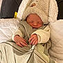 Khalifa a rejoint le concours — aidez-le/la à gagner de superbes lots ! newborn, baby, sleeping, blanket, hat, bear_hat, infant, cozy, cushion, car_seat, soft_lighting, cute, peaceful, child, clothing, indoors, portrait, resting, warm, toddler