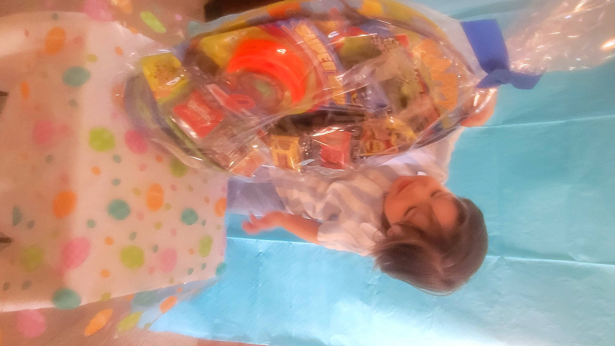 Jaylen is registered to the contest to win money with this photo: bathing, child, event, eyewear, fun, leisure, orange, person, personal_protective_equipment, plastic, smile, sunglasses, swimming_pool, toddler, toy, water