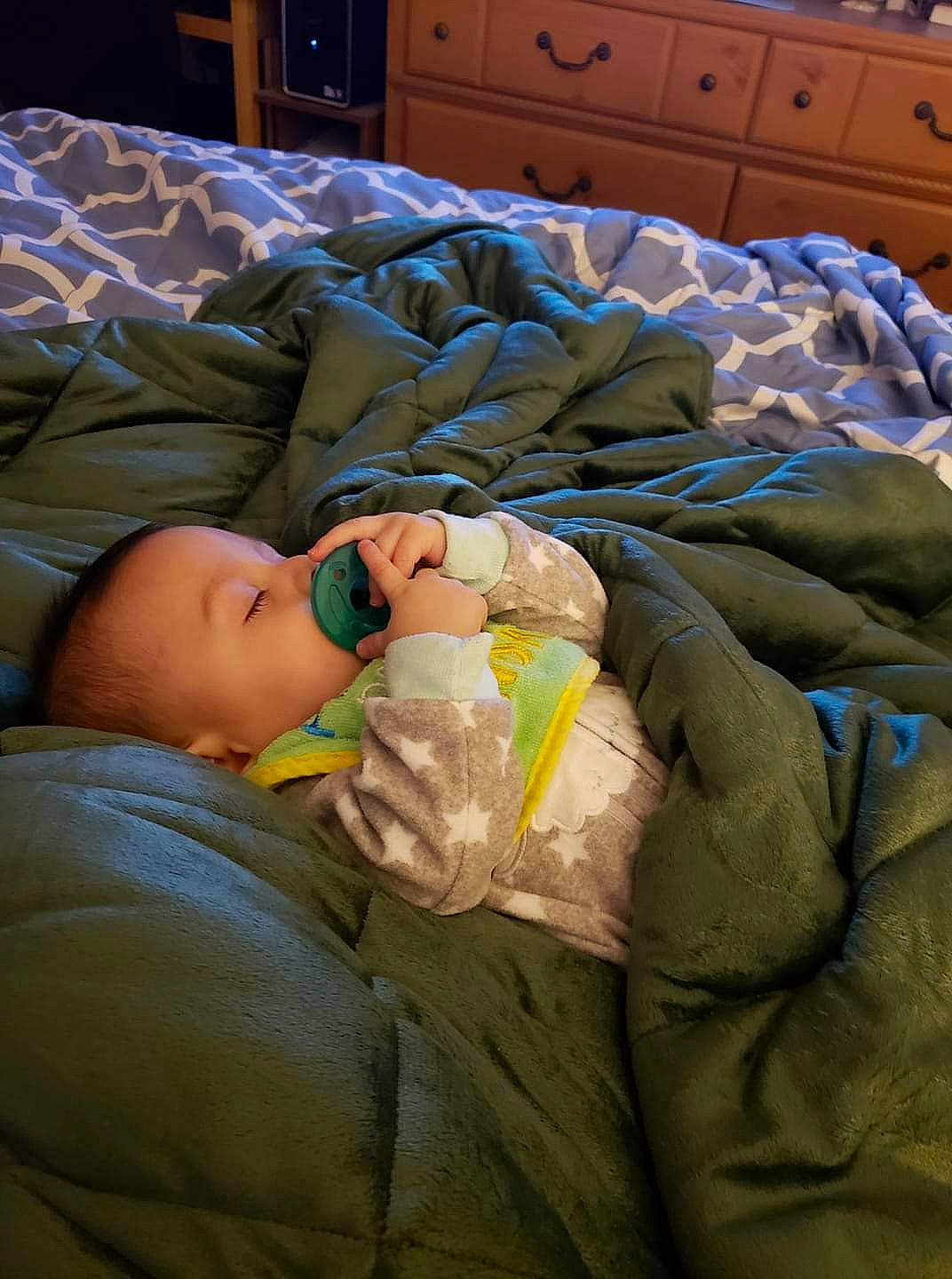 Xavier is registered to the contest to win money with this photo: baby, baby_products, bedtime, cabinetry, child, comfort, flooring, human_body, light, light_switch, linens, mouth, nap, person, room, sitting, skin, sleep, textile, toddler