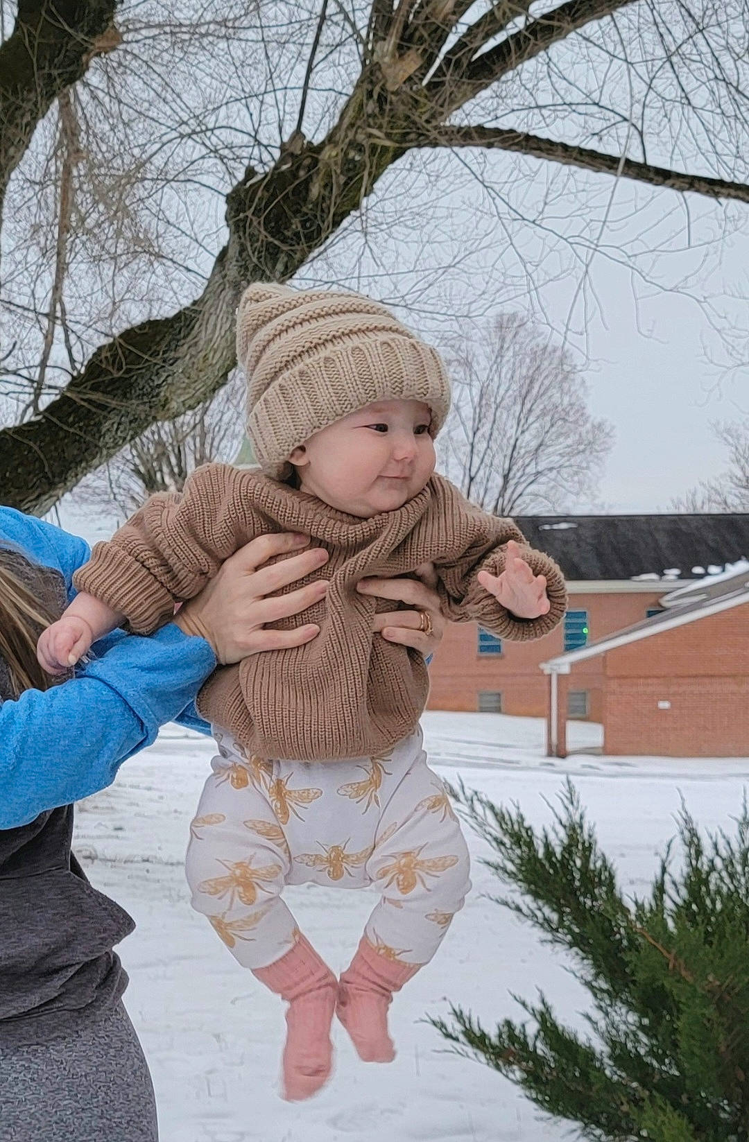 Liliya joined the competition — help win amazing prizes! baby, branch, child, event, freezing, fun, fur, grass, happy, headwear, leisure, pattern, people_in_nature, person, plant, playing_in_the_snow, sitting, sky, smile, toddler