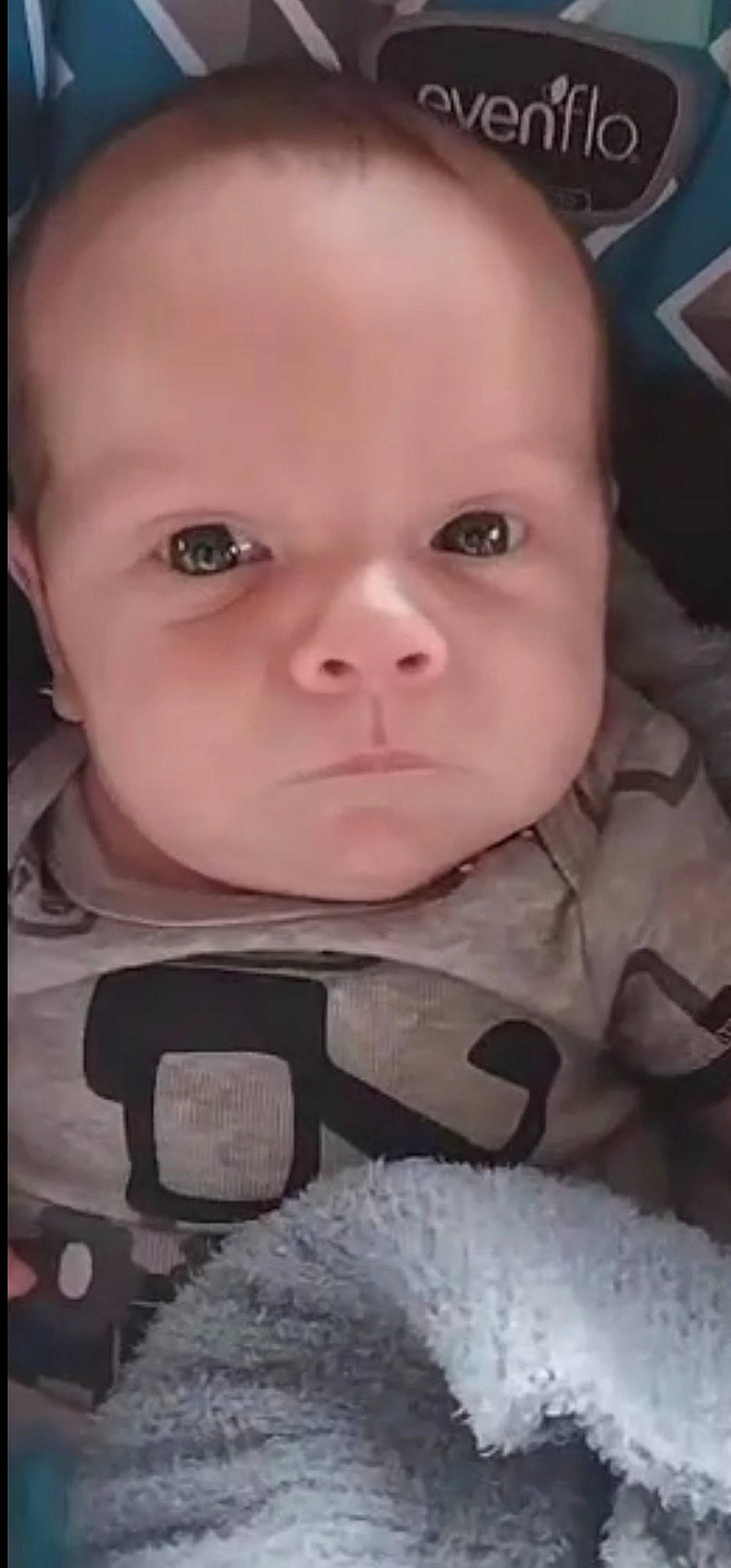 Maximus is registered to the contest to win money with this photo: baby, baby_products, baby_toddler_clothing, cheek, child, chin, close_up, comfort, eyebrow, eyelash, fun, iris, lip, mouth, nose, pattern, person, sitting, skin, sleeve