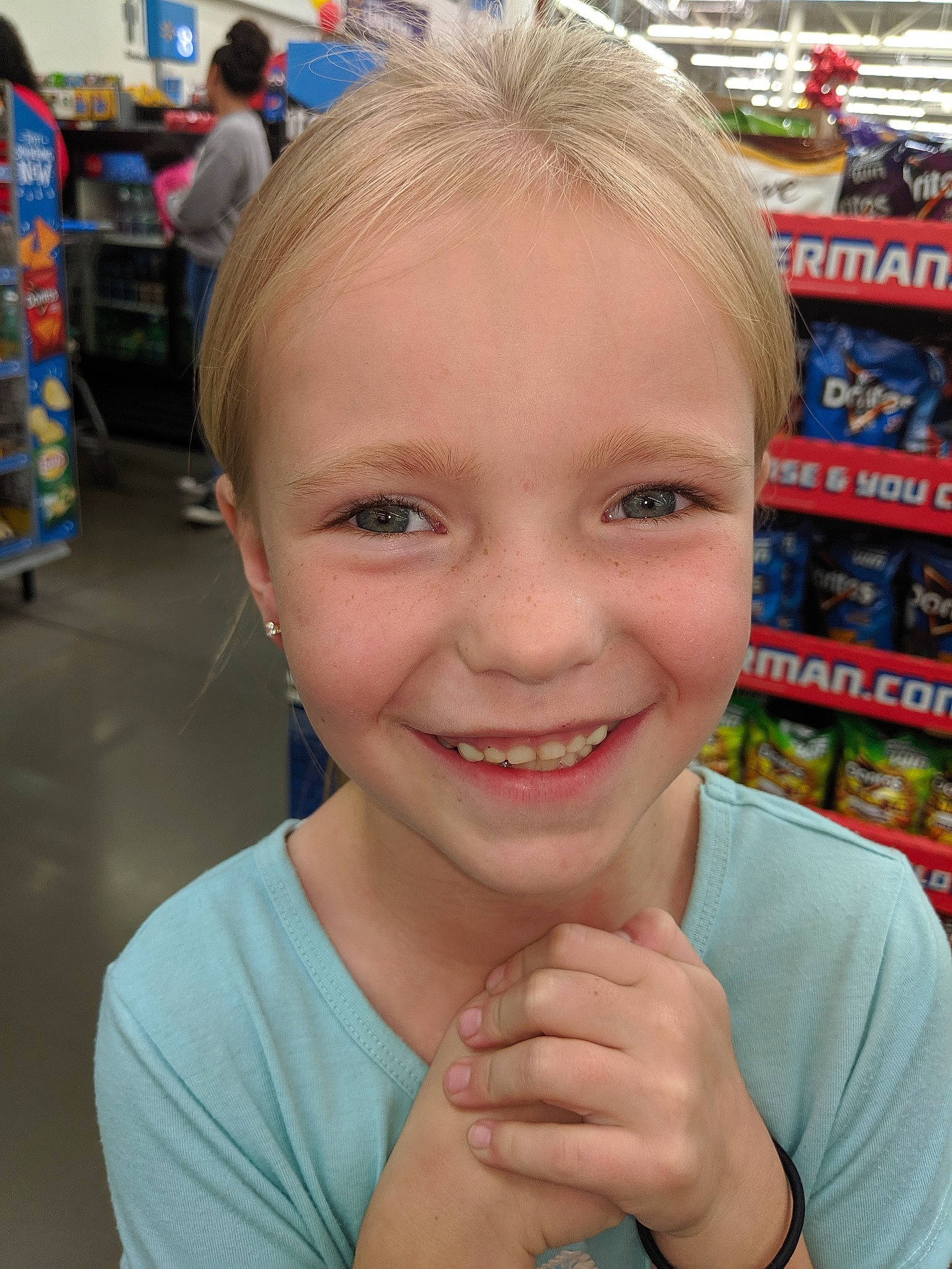 Zury is registered to the contest to win money with this photo: blond, cheek, child, chin, ear, eyebrow, face, facial_expression, forehead, fun, gesture, hair, head, joy, nose, organ, person, smile, supermarket, tooth