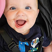 Hudson is registered to the contest to win money with this photo: baby, blue_eyes, car_seat, cheerful, child, closeup, clothing, cute, dinosaur_shirt, happy, indoors, infant, messy_face, person, portrait, safety_harness, seatbelt, smiling, toddler, young_child