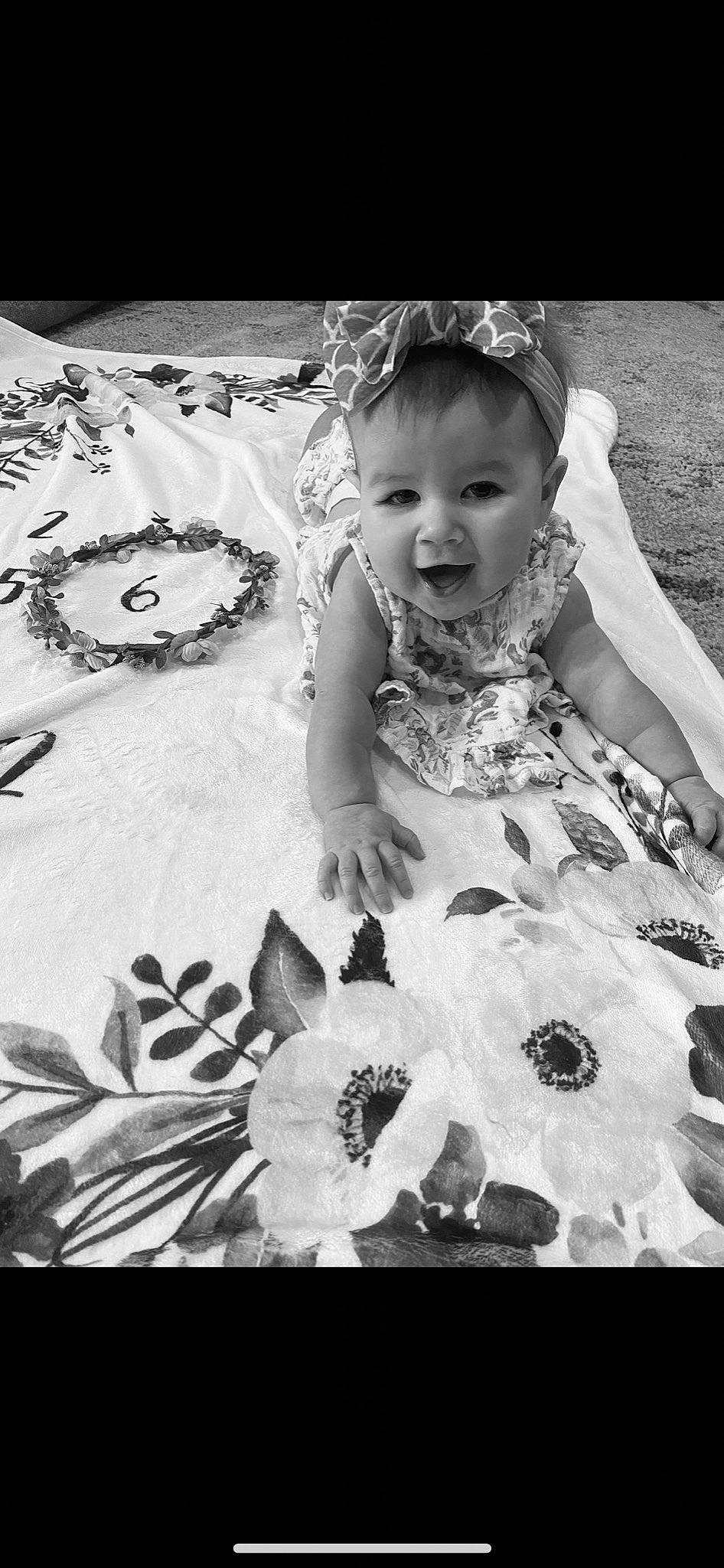 Scarlette Rae is registered to the contest to win money with this photo: baby, baby_toddler_clothing, black, black_and_white, child, dress, flash_photography, flower, happy, headpiece, iris, monochrome, monochrome_photography, pattern, person, petal, plant, smile, style, toddler