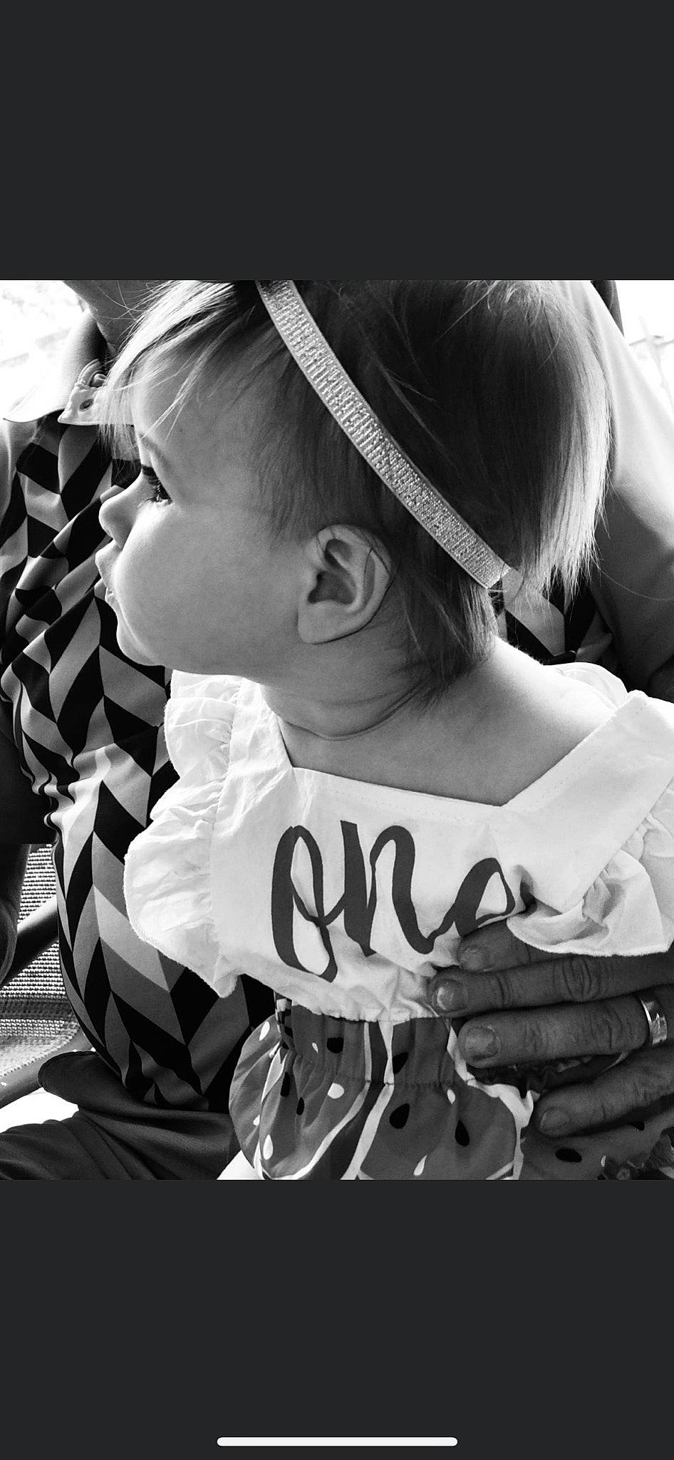 Scarlette Rae is registered to the contest to win money with this photo: black, black_and_white, cap, child, cool, elbow, facial_expression, flash_photography, font, hairstyle, happy, human, human_body, mammal, monochrome, monochrome_photography, neck, person, style, t_shirt