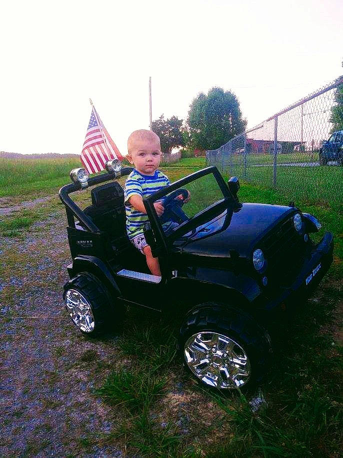 Kyson is registered to the contest to win money with this photo: alloy_wheel, automotive_design, automotive_exterior, automotive_tire, bumper, car, fender, hood, hubcap, locking_hubs, motor_vehicle, person, plant, sky, tire, tread, tree, vehicle, vehicle_door, wheel