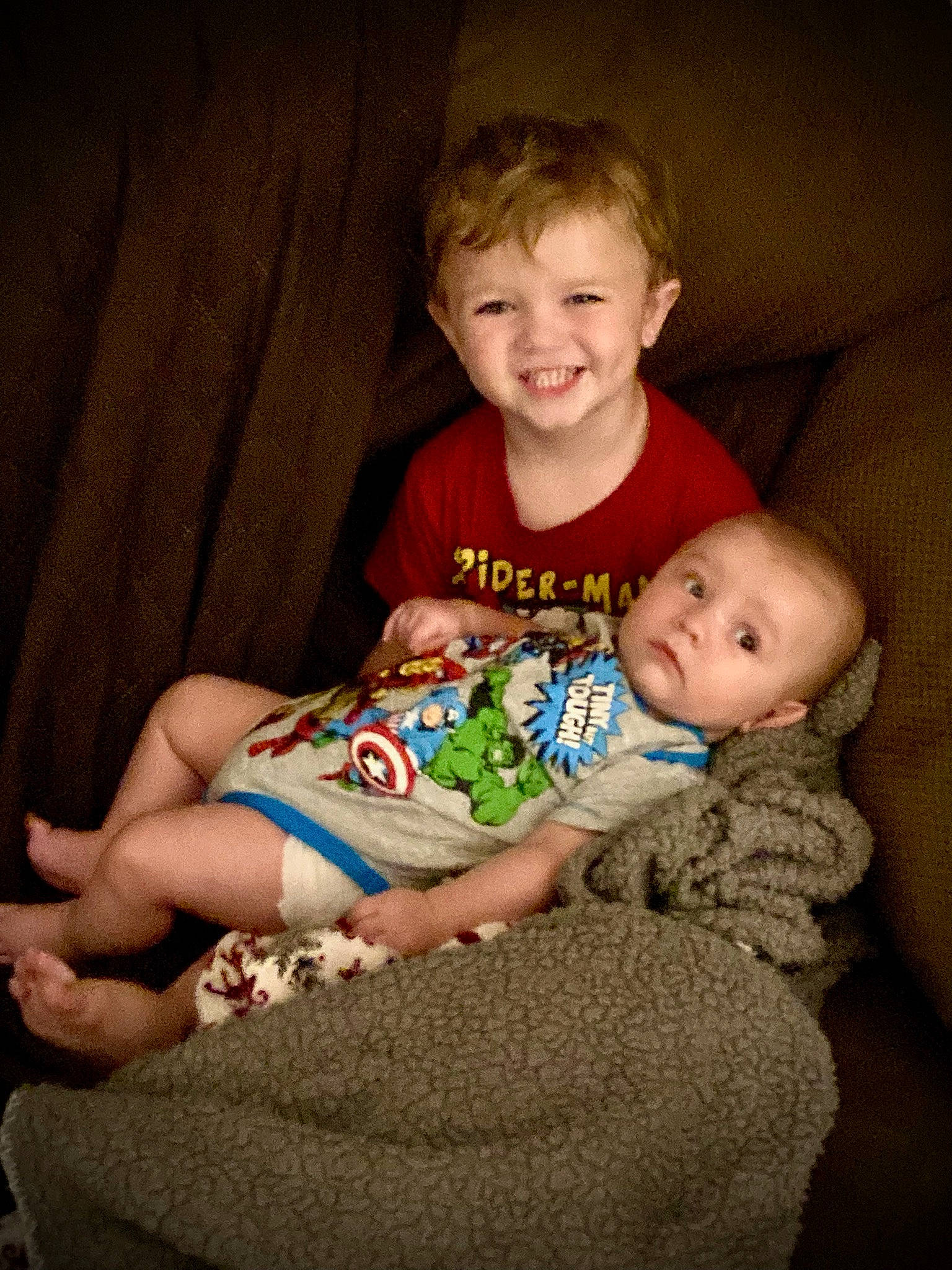 Kyson is registered to the contest to win money with this photo: baby, baby_toddler_clothing, cheek, comfort, couch, eye, face, finger, fun, happy, head, iris, joy, lap, leg, person, sitting, skin, smile, t_shirt