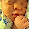 Orrian is registered to the contest to win money with this photo: newborn, baby, sleeping, portrait, face, hand, fist, blanket, swaddled, infant, peaceful, cozy, close_up, indoors, soft_light, eyes_closed, nose, mouth, clothing, resting
