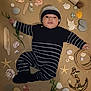 baby, infant, striped_clothing, hat, face, sand, seashells, starfish, stones, seaweed, rope, anchor, nautical, lying_down, cute, portrait, child, outdoor, decorative, arrangement