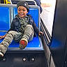 Precise joined the competition — help win amazing prizes! adult, beanie, blue_seat, boy, bus, camouflage, child, indoor, jacket, pants, passenger, portrait, public_transport, shoe_sole, shoes, sitting, smiling, toddler, vehicle, window