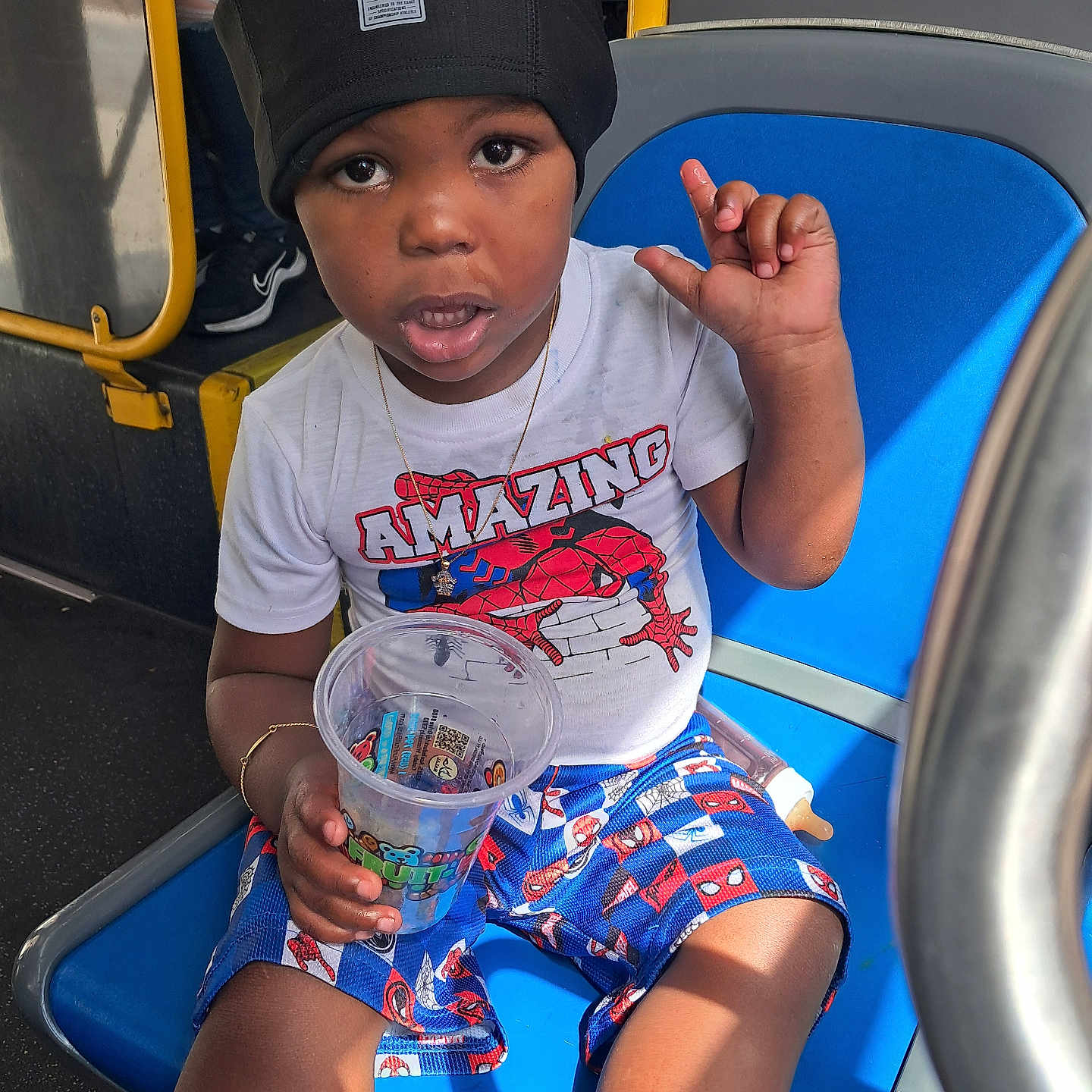 Precise joined the competition — help win amazing prizes! black_hat, blue_seat, boy, bus, child, city_bus, colorful_shorts, cup, drink, indoor, portrait, public_transportation, raised_hand, sitting, smiling, spiderman, superhero_shirt, vehicle, white_shirt, yellow_rail