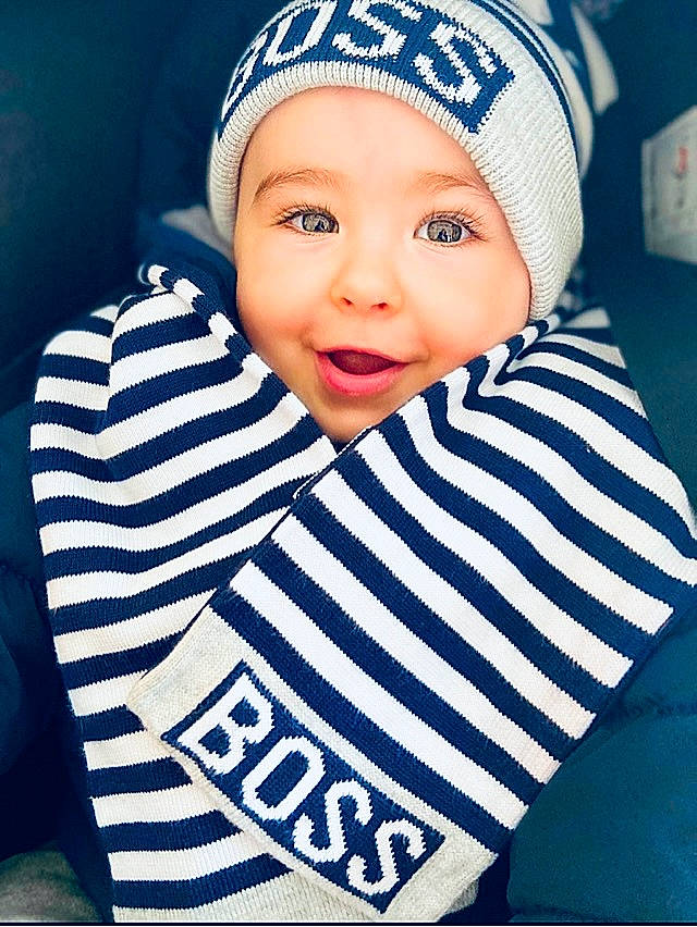 Milo participe au concours pour gagner de l'argent avec cette photo : azure, baby, baby_toddler_clothing, cap, cheek, child, cool, electric_blue, face, facial_expression, happy, headgear, headwear, knit_cap, outerwear, pattern, person, sleeve, smile, t_shirt