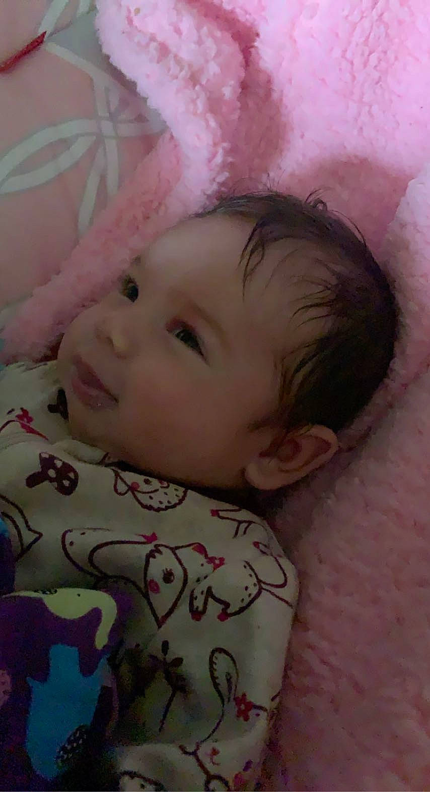 Mckinley is registered to the contest to win money with this photo: baby, baby_toddler_clothing, cheek, chin, eye, eyebrow, face, hairstyle, head, iris, lip, mammal, nose, person, pink, skin, sleeve, smile, textile, toddler