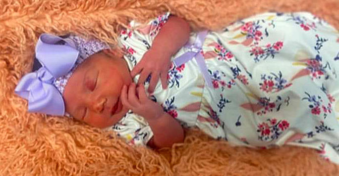 Mckinley joined the competition — help win amazing prizes! baby, baby_sleeping, baby_toddler_clothing, bedtime, brown, child, comfort, finger, headwear, human, linens, nail, nap, orange, pattern, peach, person, play, skin, sleep