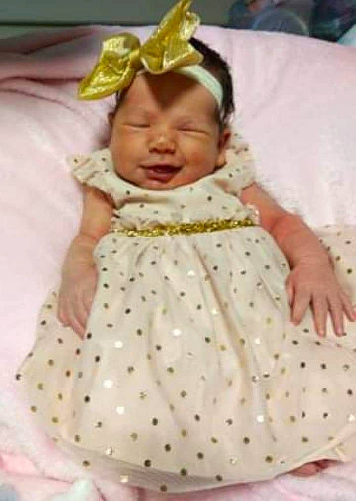 Mckinley is registered to the contest to win money with this photo: baby, baby_products, baby_toddler_clothing, bonnet, child, costume_accessory, costume_hat, day_dress, design, embellishment, hair_accessory, headband, headgear, headpiece, linens, pattern, person, pink, product, textile