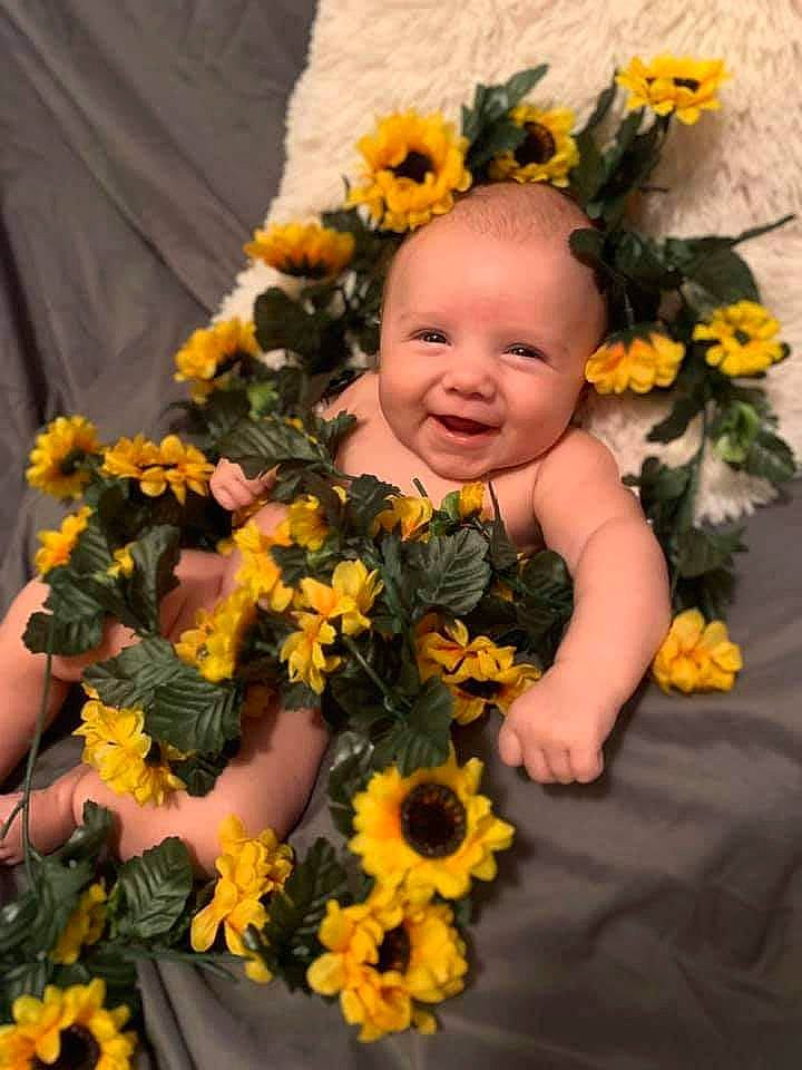 Anessa joined the competition — help win amazing prizes! annual_plant, bouquet, child, cut_flowers, floral_design, floristry, flower, flower_arranging, joy, person, plant, sunflower, toddler, yellow