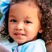 Renayle joined the competition — help win amazing prizes! child, curly_hair, blue_bow, blue_shirt, portrait, outdoor, young_child, face, person, cute, expression, skin, hair, head, childhood, people, natural_light, closeup, childrens_clothing, baby