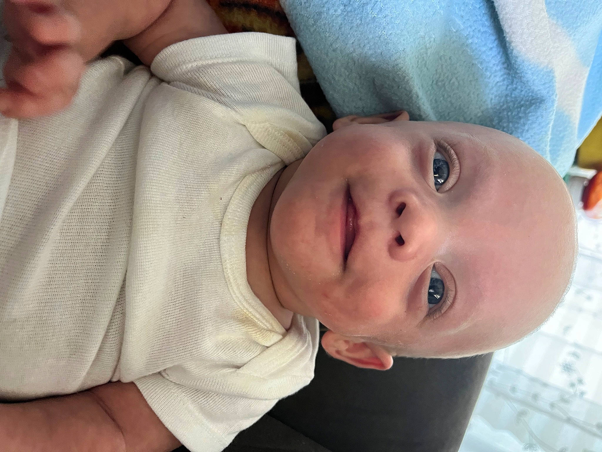 Nathaniel is registered to the contest to win money with this photo: baby, baby_products, baby_toddler_clothing, cheek, child, comfort, elbow, eyelash, finger, gesture, happy, iris, lip, mouth, nose, person, portrait_photography, skin, sleeve, smile