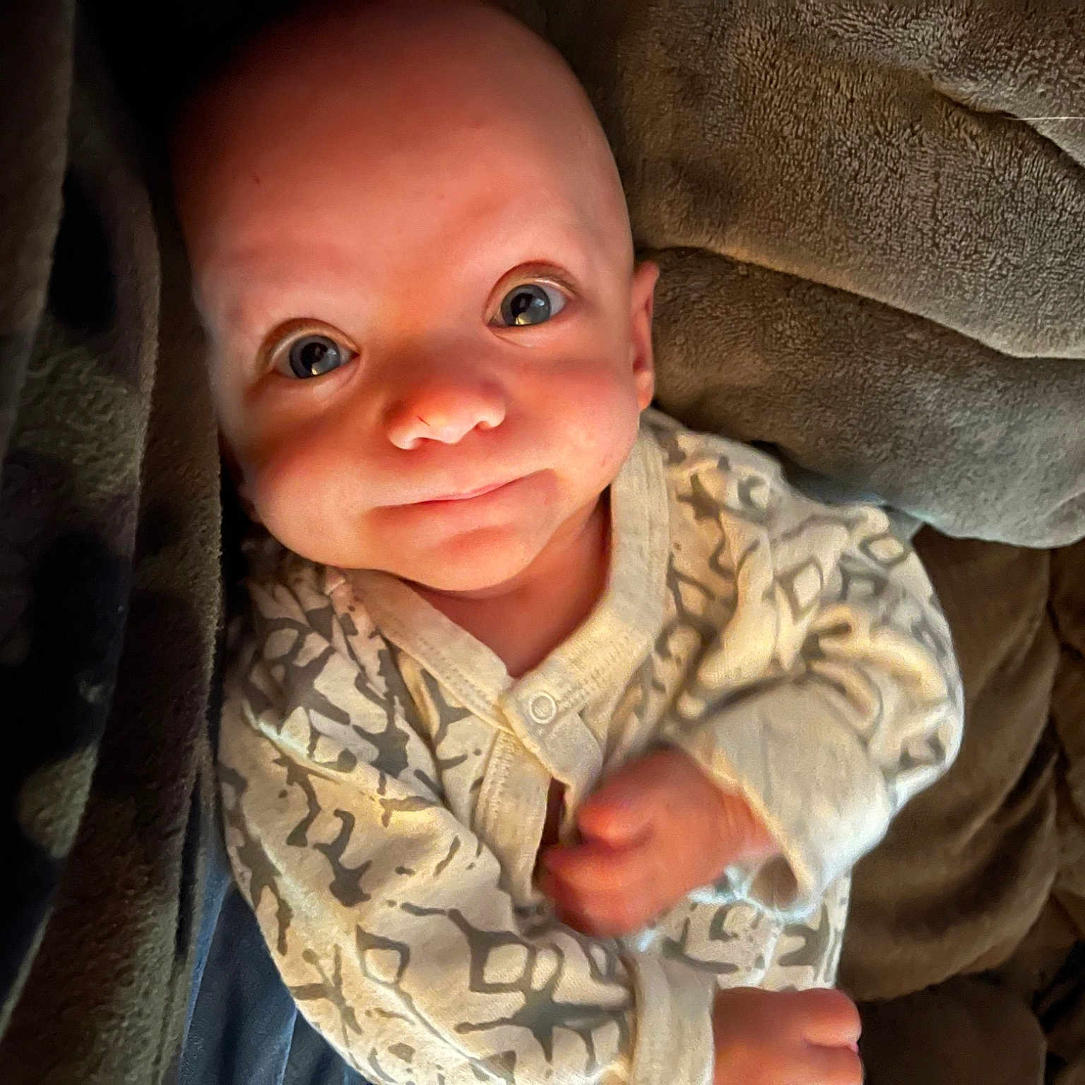 Nathaniel joined the competition — help win amazing prizes! baby, cheek, child, comfort, eye, flash_photography, gesture, happy, head, human_body, iris, military_camouflage, nose, outerwear, plant, skin, sleeve, smile, toddler, wood