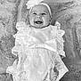 baby, smile, lace, headband, flower, infant, portrait, cute, happiness, lying_down, soft_texture, blanket, clothing, person, child, adorable, happy, baby_girl, monochrome, closeup
