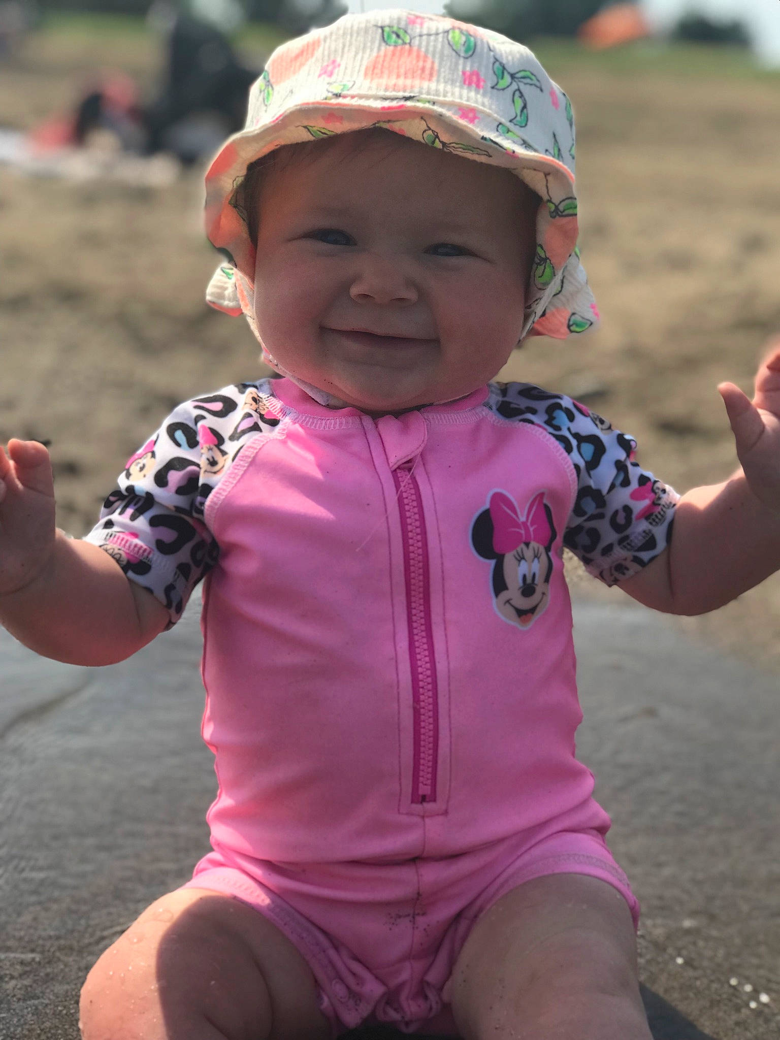 Carlee is registered to the contest to win money with this photo: baseball_cap, body_of_water, chin, cool, facial_expression, gesture, grass, happy, headgear, headwear, human, joy, lip, mouth, person, photograph, pink, recreation, skin, sleeve