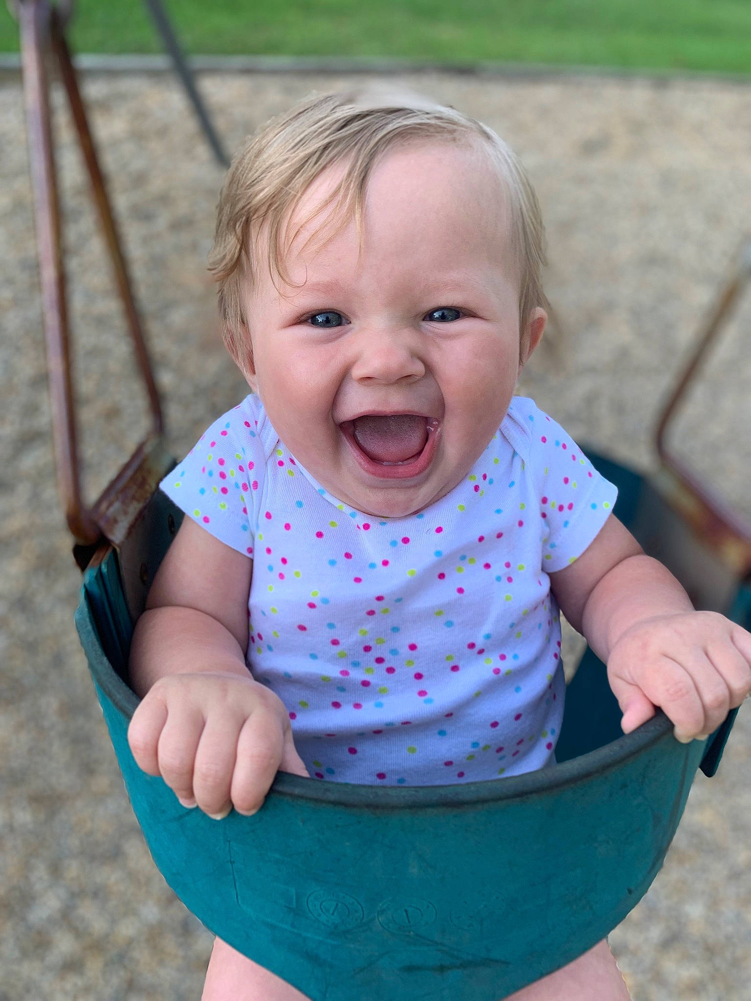 Carlee is registered to the contest to win money with this photo: baby, baby_toddler_clothing, cheek, eye, face, facial_expression, grass, hair, hand, happy, head, human_body, leisure, person, pink, skin, sleeve, smile, standing, toddler