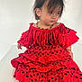 Lucia a rejoint le concours — aidez-le/la à gagner de superbes lots ! child, toddler, red_dress, polka_dot, frills, beaded_necklace, sitting, curly_hair, indoor, portrait, cute, baby, fashion, expression, person, foot, hand, hair, clothing, face