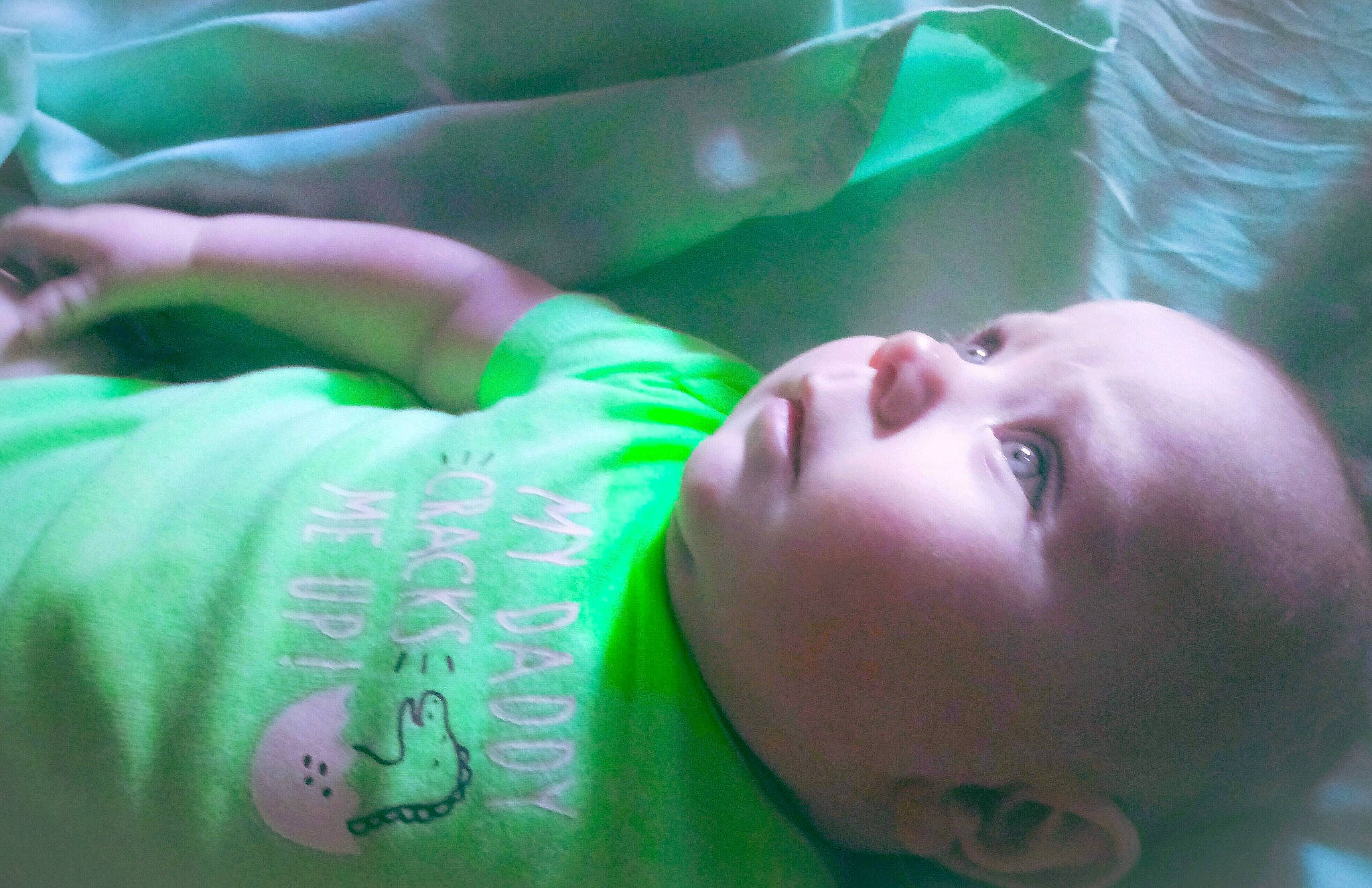 Leelan is registered to the contest to win money with this photo: baby, cheek, child, ear, eye, eyebrow, face, forehead, fun, green, hand, happy, head, lip, mouth, neck, nose, person, photography, skin