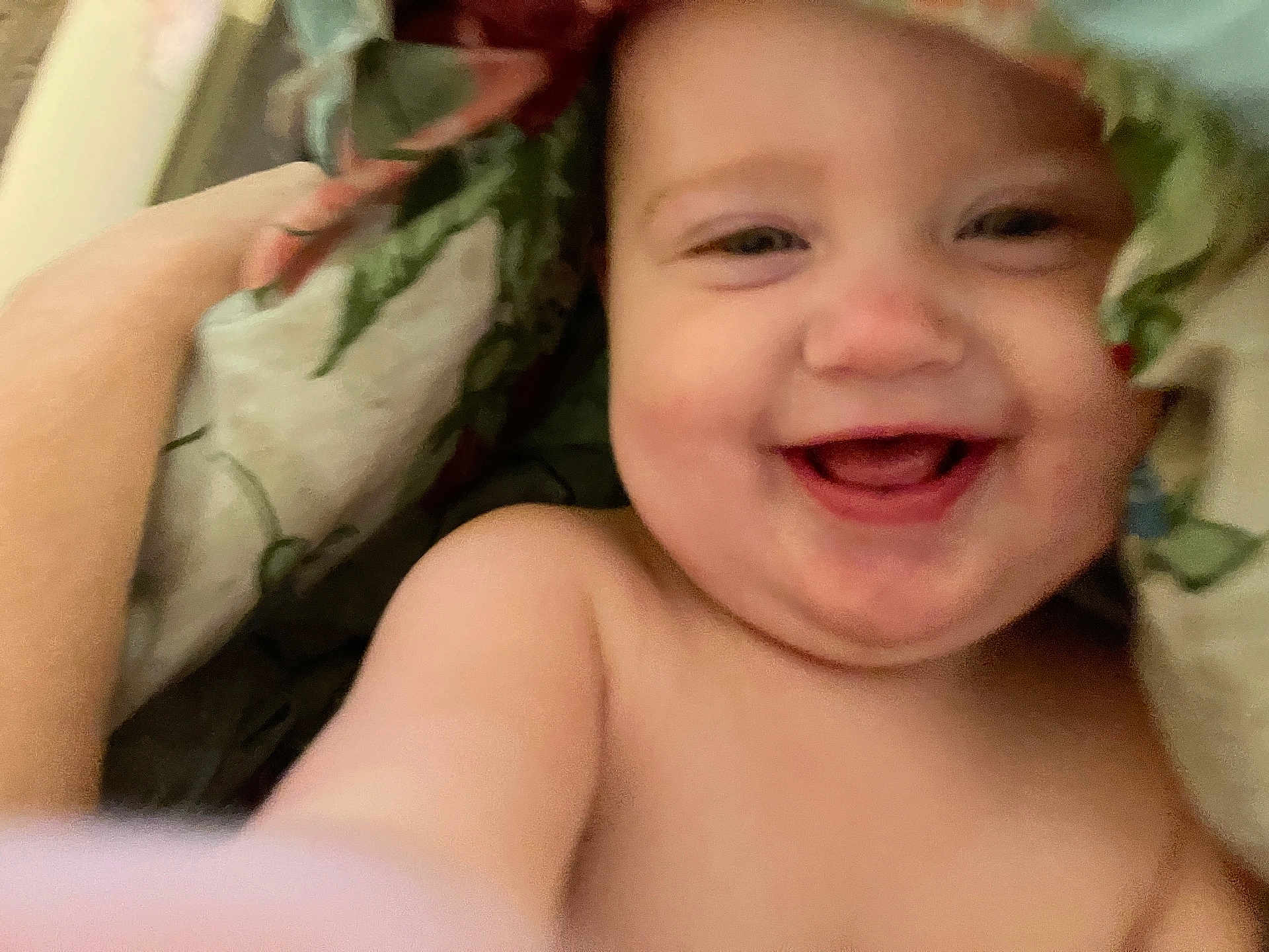 Maysie is registered to the contest to win money with this photo: baby, smiling, face, child, blanket, soft, happy, skin, closeup, indoors, comfort, cute, expression, young, portrait, infant, hand, natural, cozy, playful