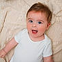 Jesse joined the competition — help win amazing prizes! baby, infant, child, onesie, white_clothing, blue_eyes, surprised_expression, lying_down, blanket, beige, soft_texture, cute, portrait, skin, face, arm, human, newborn, happy, adorable