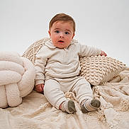 Jesse joined the competition — help win amazing prizes! baby, child, infant, cute, sitting, blanket, pillow, cozy, clothing, portrait, studio, soft_texture, expression, head, face, sock, home, comfortable, young, innocent