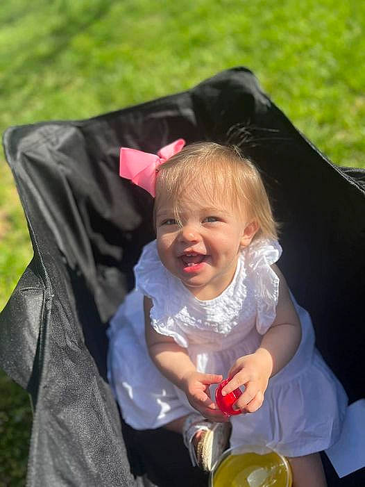 Addilynn is registered to the contest to win money with this photo: baby, baby_carriage, baby_products, child, citrus, event, fashion_accessory, fruit, fun, gesture, grass, happy, juice, lemon, meyer_lemon, person, recreation, sitting, smile, toddler
