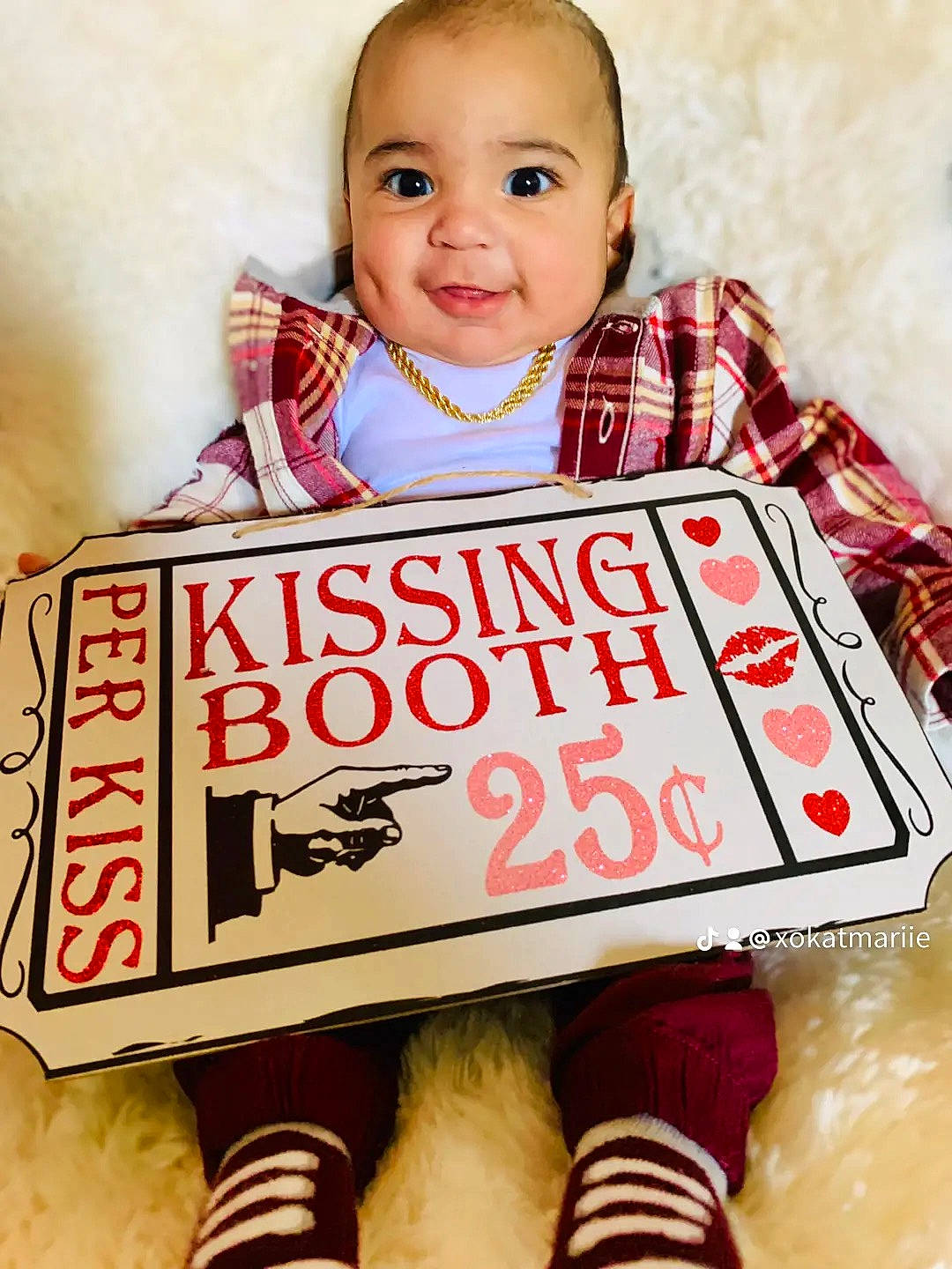 Christopher Jr. is registered to the contest to win money with this photo: baby, baby_toddler_clothing, beauty, book, child, facial_expression, font, happy, joy, pattern, people, person, play, portrait_photography, product, publication, room, sitting, sleeve, smile