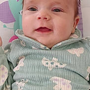 Kinslee joined the competition — help win amazing prizes! apparel, baby, bow, child, clothing, colorful, cute, denim_pants, face, happy, headband, indoor, infant, patterned_top, person, portrait, seated, smile, soft_background, young