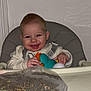 Edzyo participe au concours pour gagner de l'argent avec cette photo : baby, child, highchair, toy, smile, red_eye, flash, tray, plastic_bag, bag_of_seeds, hands, face, clothing, strap, ear, indoor, wall, portrait, table, happy