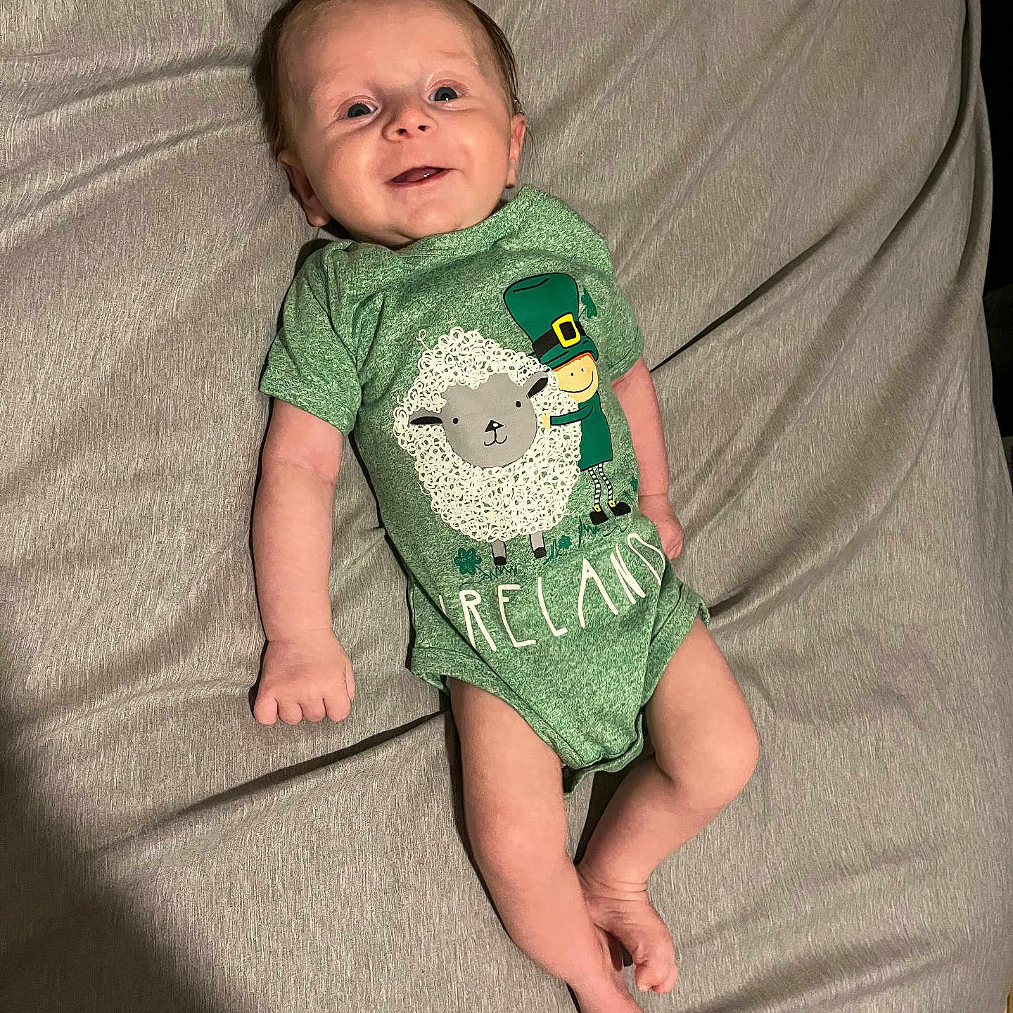 Mason is registered to the contest to win money with this photo: applique, baby, bodypart, clothing, couch, cushion, face, finger, furniture, hand, happy, head, homedecor, newborn, pattern, person, photography, portrait, smile, t_shirt